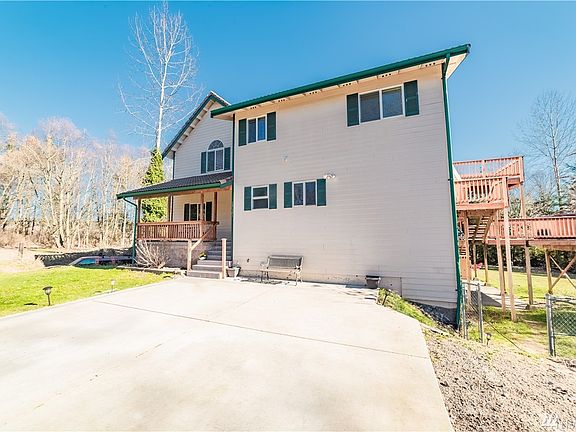 Privacy abounds on this shy 5 acre property featuring Mt Rainier views, pasture land, 3388 square foot home with 2 car garage, fully fenced acre and outbuilding 