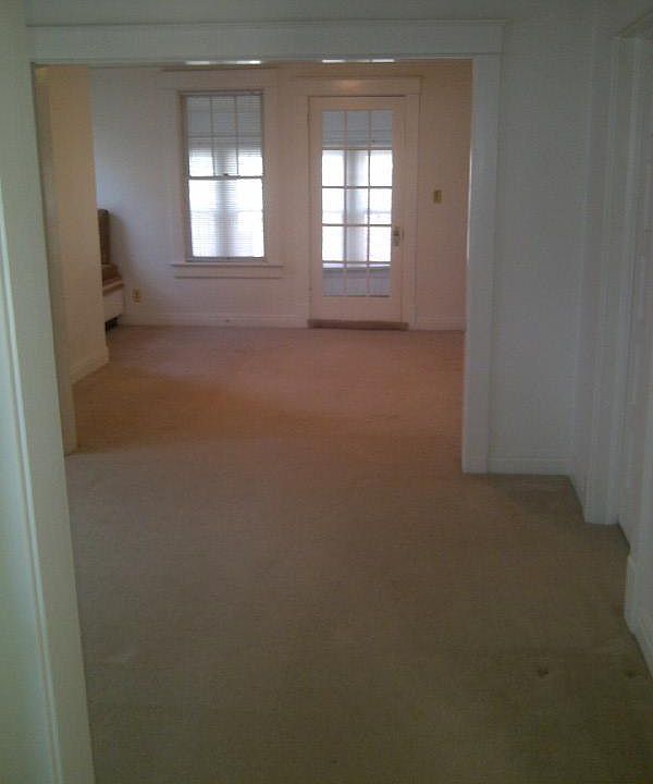 view from bathroom through dining room, living room toward front porch