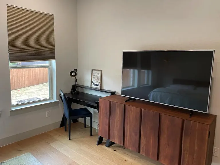 Master Bedroom with Backyard View, and 60-inch Smart TV