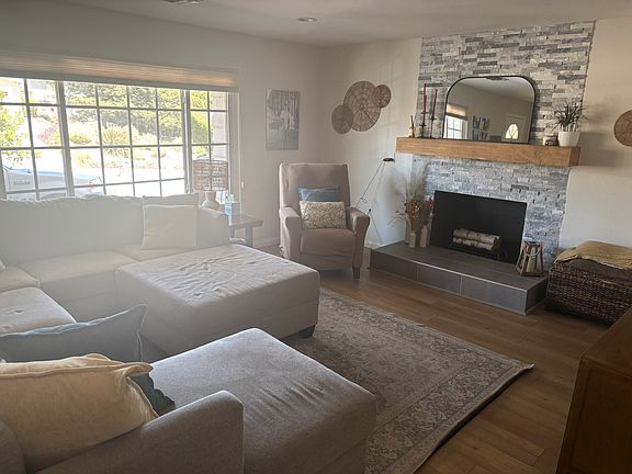 Living room with fireplace. (Does not work but the mantel is beautiful).