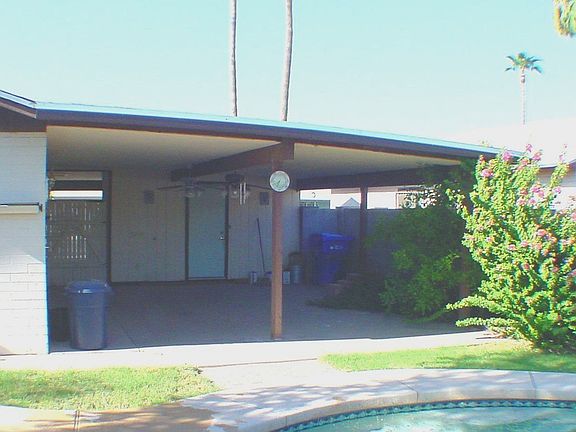 Back Of Home, Covered Patio that has two Ceiling Fans to keep you Cool.