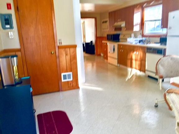 Hallway kitchenette and dining area