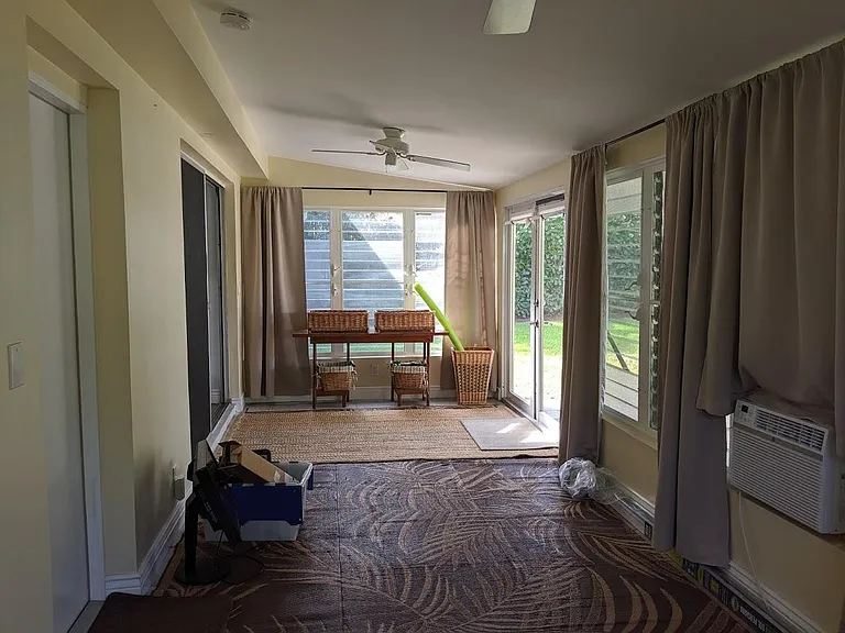 Florida room, looking towards sliding glass doors (into house) and french doors, (which lead to backyard).