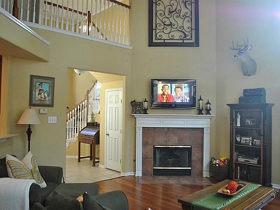 2 story den with wood burning fireplace