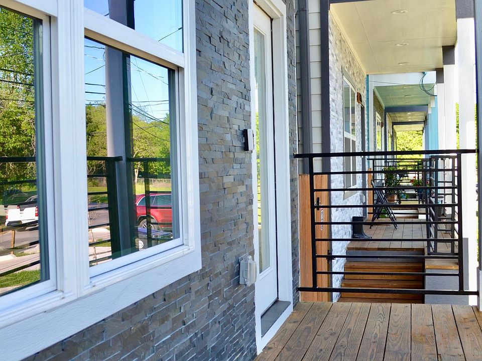 front porch with stacked stone wall