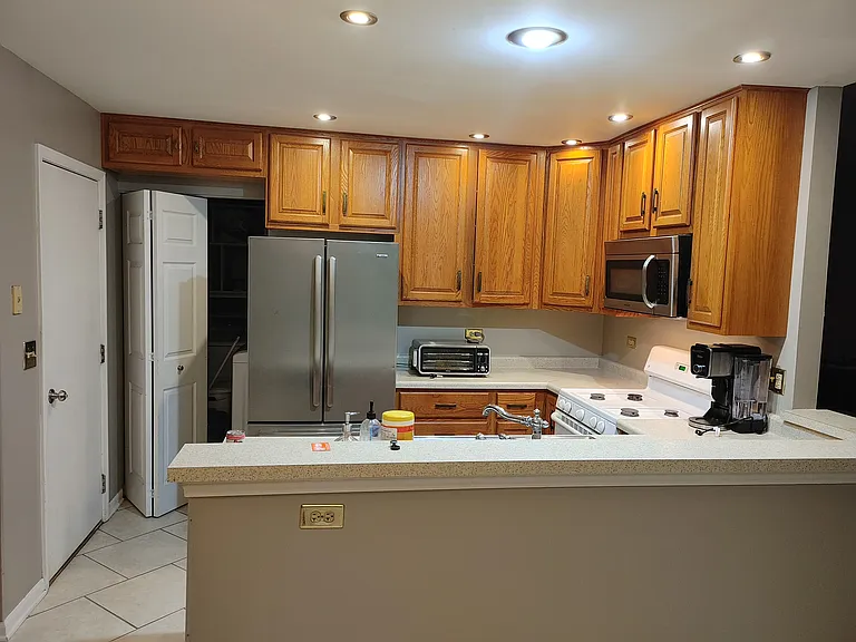 Kitchen laundry is behind the bifold door on the left