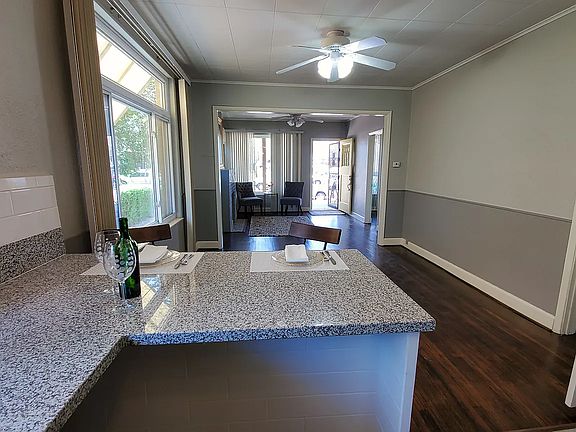 KITCHEN FACING DINING AND LIVING ROOMS