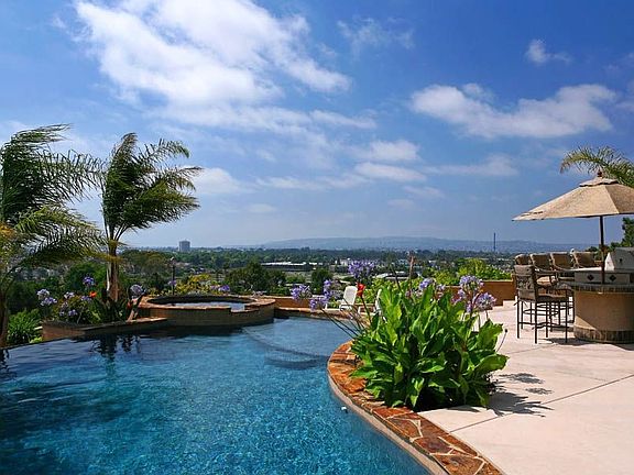 Vanishing edge pool, heated spa, outdoor cooking & dining