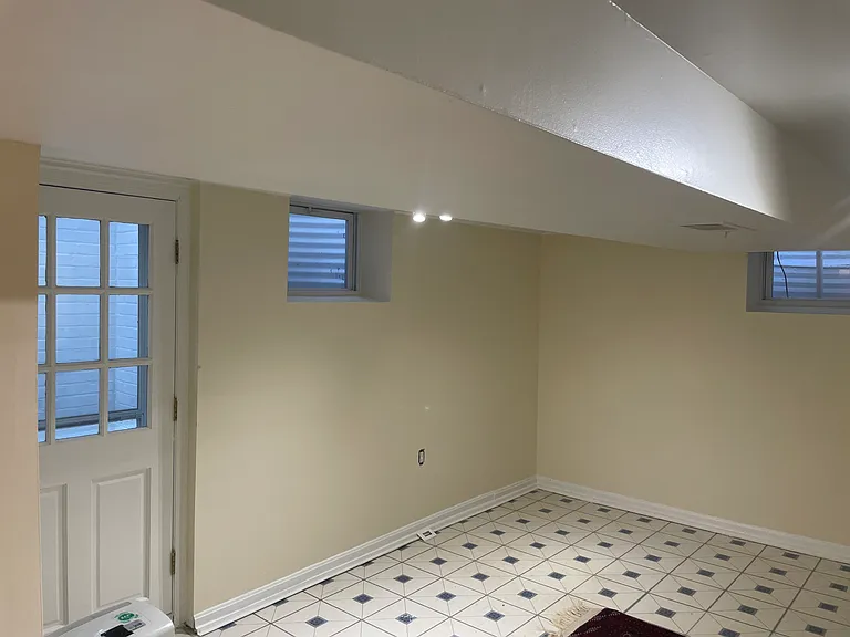 basement with exit door to backyard
