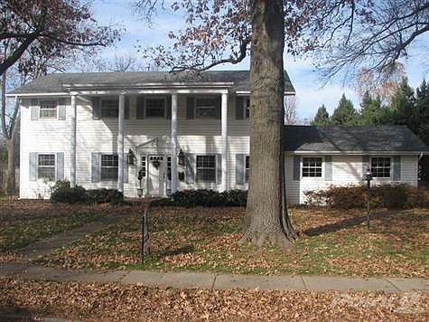 Beautiful colonial style on a large corner lot with magnificent  oak trees.  Maintenance free exterior with a newer roof.