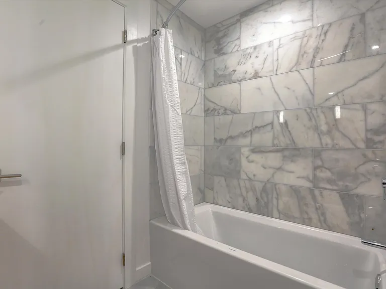 The second story bathroom features a tub and shower.