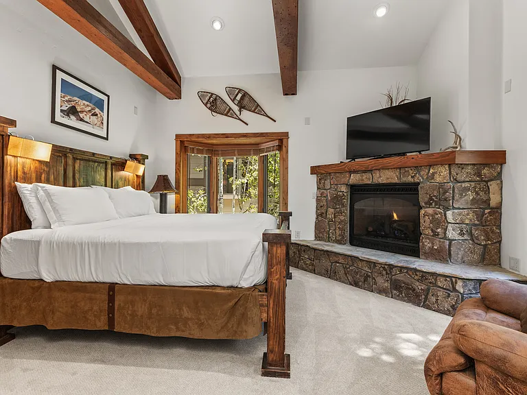 Top Level - Ensuite King Bedroom #1 with Gas Fireplace & SmartTV