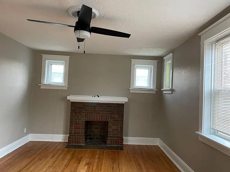 Newer light fixtures, decorative fireplace