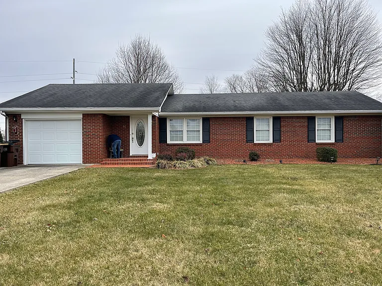 3 to 4 bedroom brick ranch with garage and covered front porch in a super nice neighborhood.