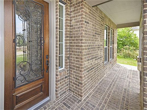 A front porch with stone pavers makes the statement of quality.