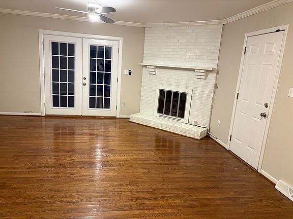 Large Den w/ FP and French Door Leading to Patio and Flat Fenced Back yard w/ Shed