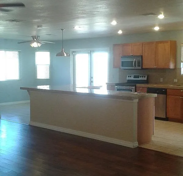 Great Room into kitchen. Fresh white paint