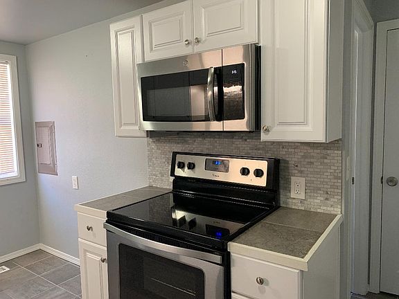 Brand new stainless steal range and built in microwave oven.