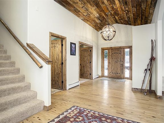 Foyer with beautiful reclaimed wood ceiling