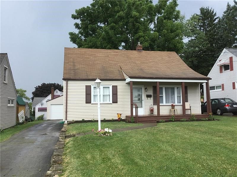 COZY, MANAGEABLE, VINYL-SIDED, CAPE-COD STYLE HOME HAS 4 BEDROOMS AND 2 FULL BATHS.
