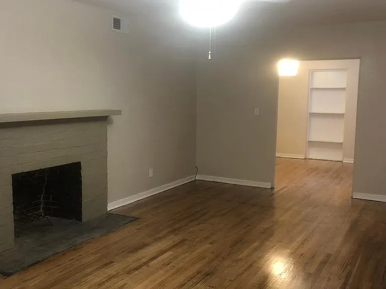 Family cum Living showing Entrance to Dining and Fire Place.