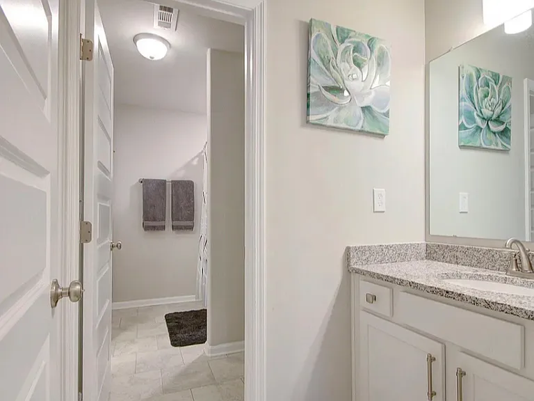 Jack-n-Jill bathroom upstairs for secondary bedrooms. Attaches to one bedroom, and loft area; complete with 2 separate vanity areas, and bathtub shower combo
