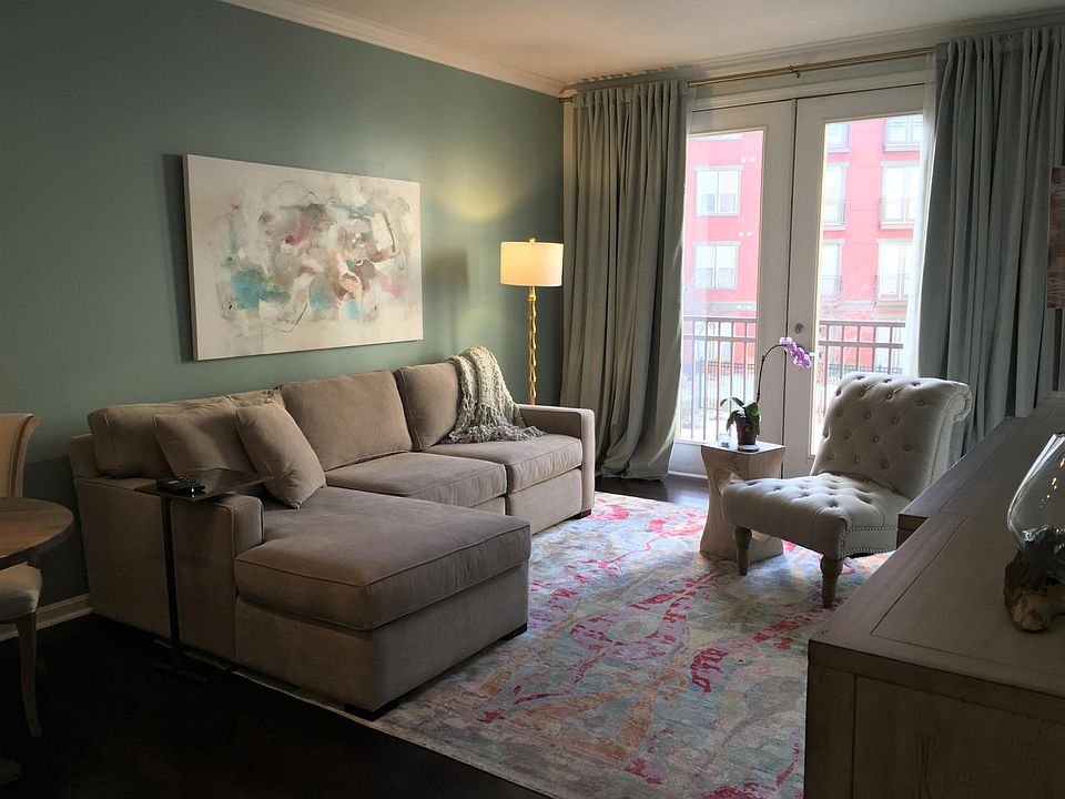 Light living space overlooking pool courtyard