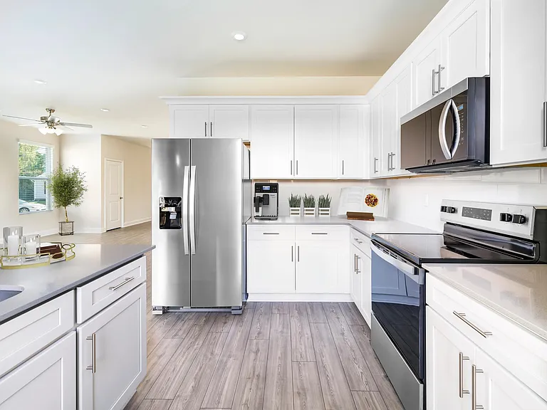 A bright, contemporary kitchen at Amavi Brier Creek, designed for everyday ease with Durham's Brier Creek dining, shopping, and conveniences nearby.