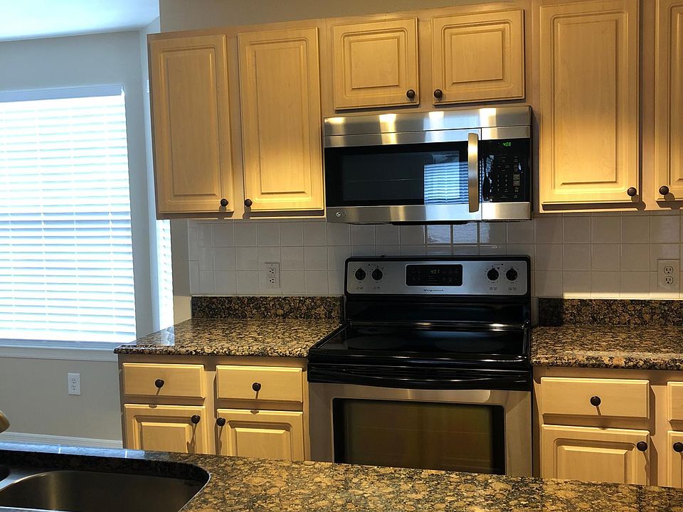 Updated kitchen lighting and beautiful granite counters
