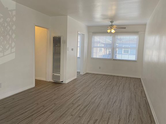 View of the living room and dining area as you walk into the apartment.