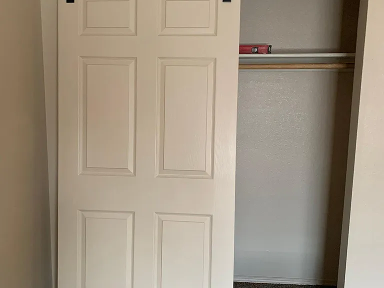 Installing new barn door style closets in both downstairs bedrooms