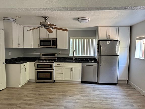 Full kitchen with dishwasher and double oven