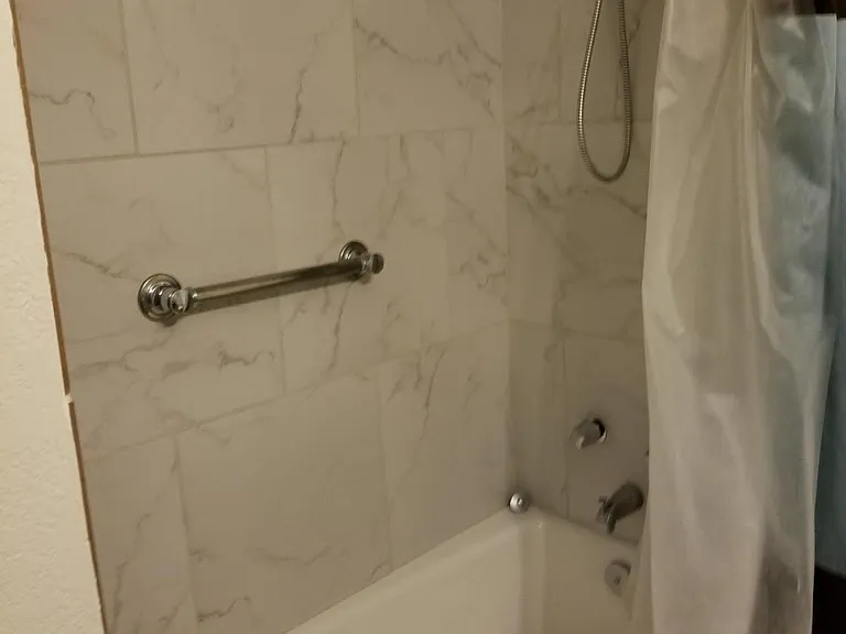 Full bathroom near living room and bunk bedroom