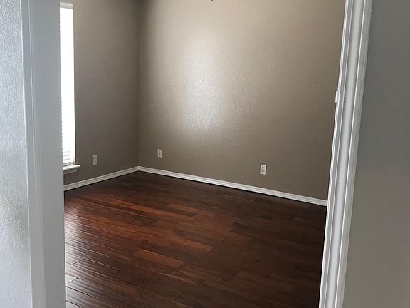 Master bedroom with new woodplank flooring.