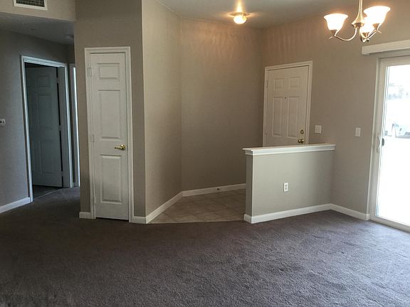View of entry from living room. Coat closet on left.