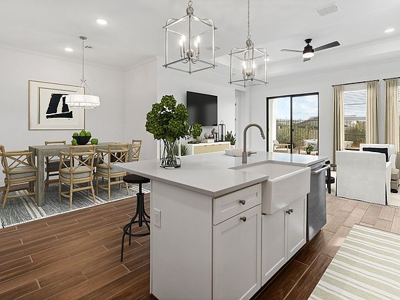 Kitchen with pendant lighting overlooking the great room