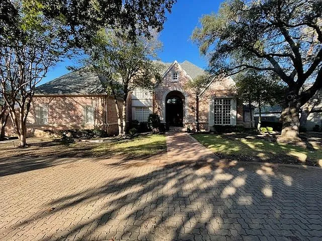 English style home with brick siding