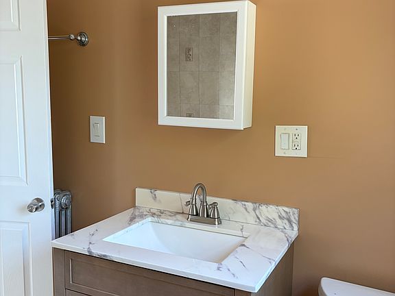 Updated bathroom, new never used vanity mirror and light.