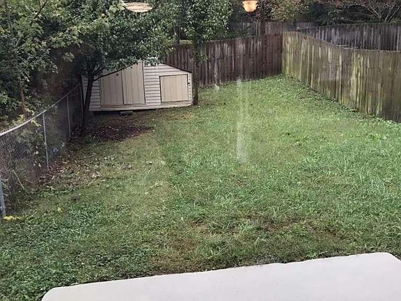 Fully Fenced Back Yard with Storage Shed that have electric