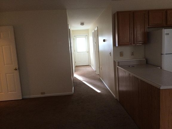 Wall to wall carpeting in living room, down hall to back doo