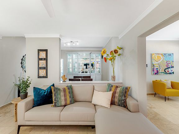 Living Room with opening to Dining Area
