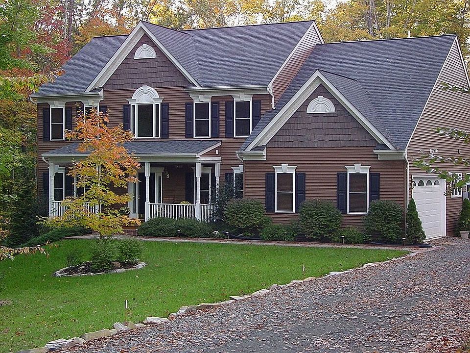 front of house w/ custom cedar vinyl siding
