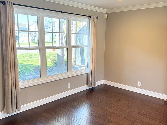Front living room features large windows for lots of natural light