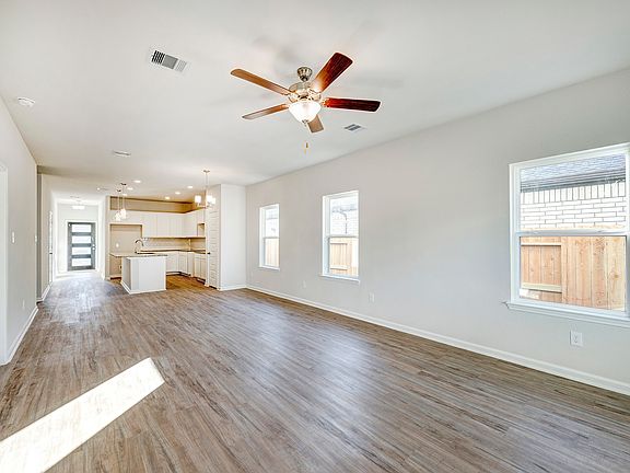 Family Room into Kitchen. Sample image for illustration upgrades, options, and colors may vary.