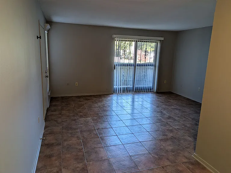 This is the view from the dining area across the living room toward the balcony patio.