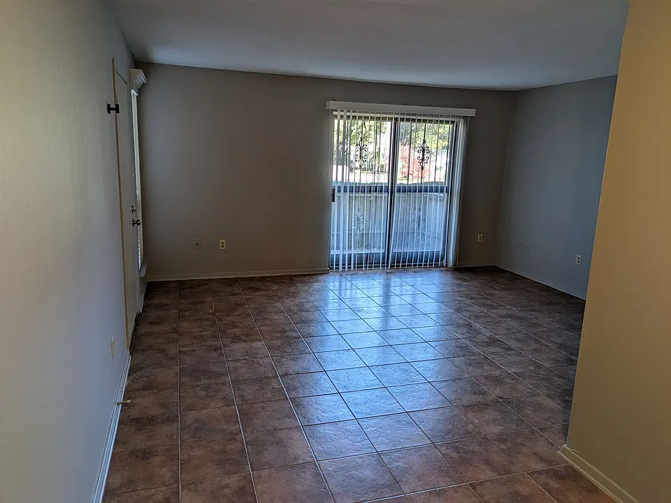 This is the view from the dining area across the living room toward the balcony patio.