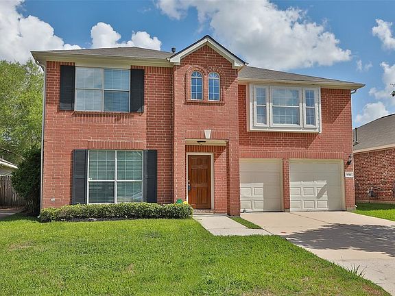 This two story brick home offers 4 bedrooms, a formal living and dining and a family room with fireplace off the open concept kitchen.