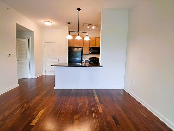 Great Room/Open Kitchen with Sleek Granite Counters. New Stainless Appliances to be Installed in August