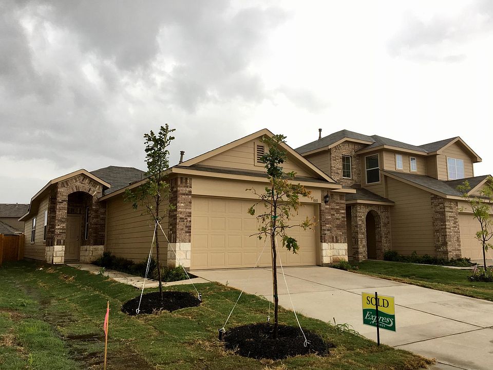 The view as you drive up to this great house with 2 nice oak