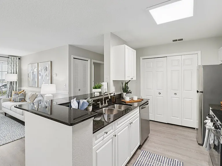 Stylish clubhouse kitchen and dining space for residents